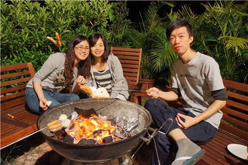 Maggie, Karen and Ho barbecuing their food