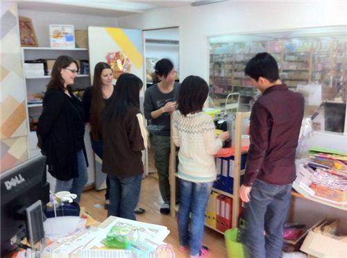 Everybody gathers around to get a cup of coffee
