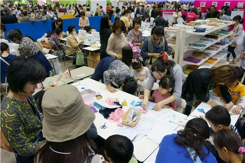 A woman is helping a child