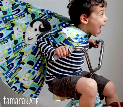 What a fun picture! We love the cape made with the Tamara Kate fabric for Michael Miller