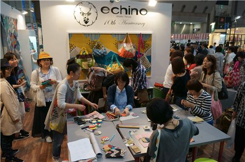 Women making handbag decoration from wonderful Echino fabrics. 