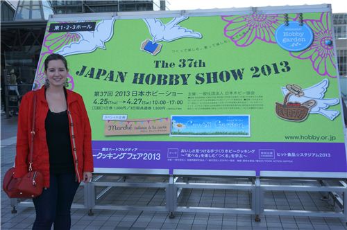 Sandra next to the official poster of the Japan Hobby Show 2013