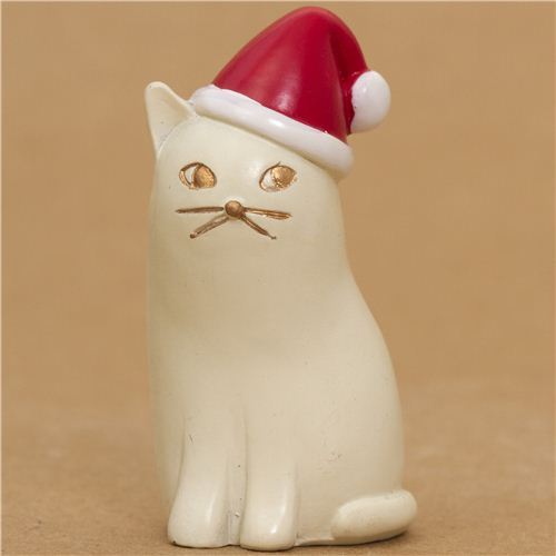 cute white cat with red Santa Claus hat from Japan